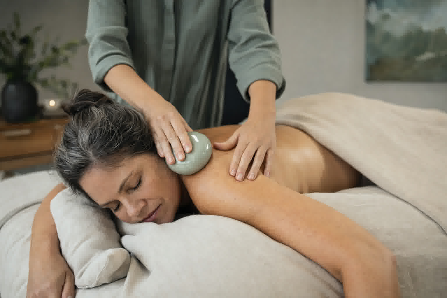 A body cupping and lymphatic treatment in progress with a smooth ceramic tool